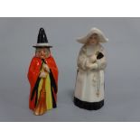 TWO ROYAL WORCESTER CANDLE SNUFFERS, witch with red cape, black painted hat and broom, puce mark