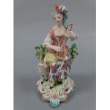 AN 18TH CENTURY DERBY FIGURINE, c.1765-70, musical shepherdess, modelled as shepherdess sat on