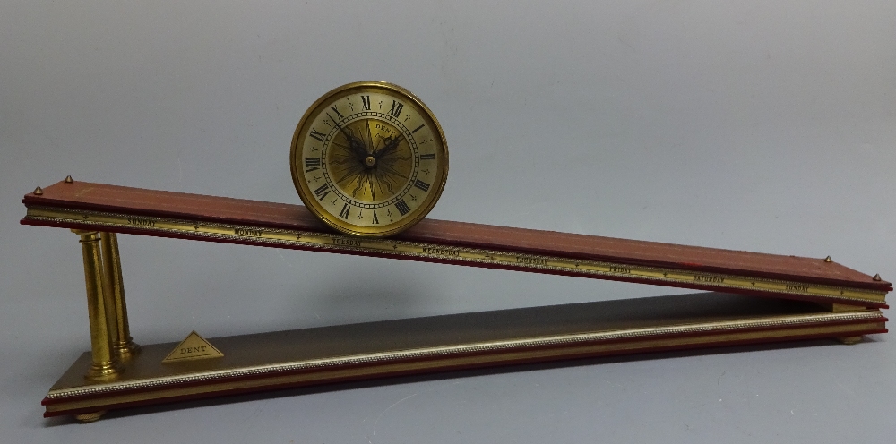 A GRAVITY CLOCK, by Dent of London, having brass cylindrical time piece with Roman numeral chapter