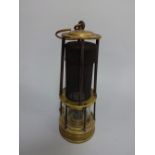 A BRASS AND GAUZE DAVY MINERS LAMP, having brass domed top impressed CLN 206 over tapering central