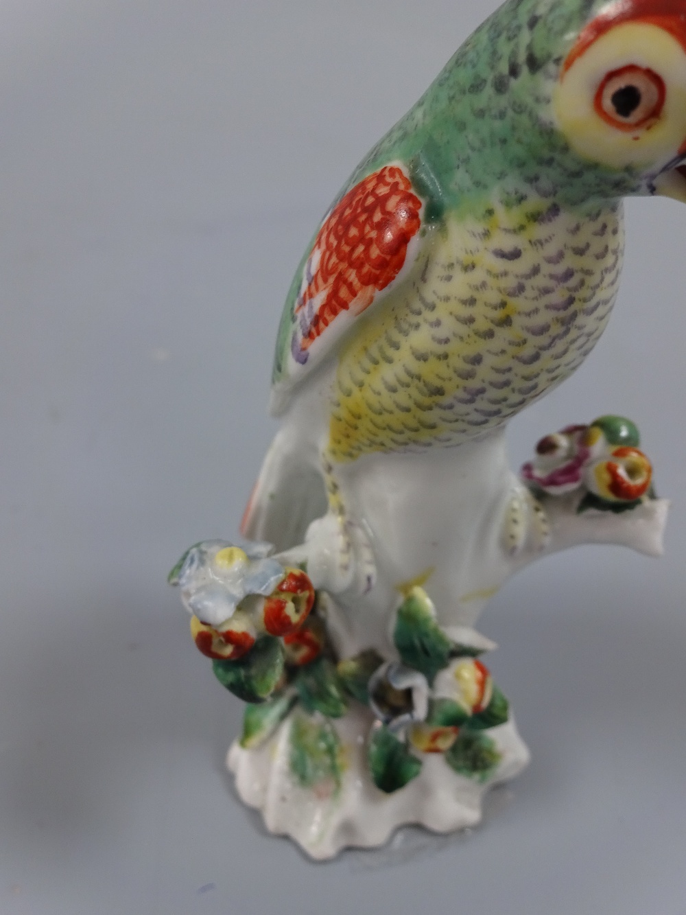 A DERBY PARAKEET FIGURE, c.1765, on floral encrusted branch, approximately 9.5cm high (a/f) (D. - Image 4 of 4