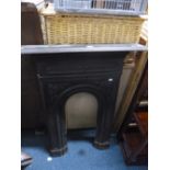 A CAST METAL FIRE SURROUND, approximate size height 98cm x width 74cm