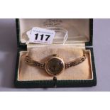 AN EARLY 20TH CENTURY LADIES GOLD WRIST WATCH, round case measuring approximately 25mm in
