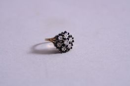 A 9CT DIAMOND AND SAPPHIRE CLUSTER RING, ring size O