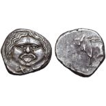 Etruria, Populonia AR 20 Asses. 3rd century BC. Facing head of Metus, tongue protruding, hair