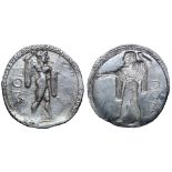 Lucania, Poseidonia AR Stater. Circa 530-500 BC. Bearded Poseidon, diademed and wearing chlamys over