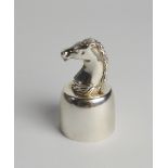 A Hermes silver plated wine bottle top surmounted with a horses' head, stamped 'Hermes Paris',