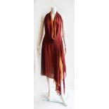 Diane von Furstenberg: A silk handkerchief dress, in shades of gold, amber and raspberry,