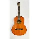 A Yamaha acoustic six string guitar with retailer's label 'J.P.