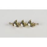 A silver and gold 'Happy Moons' bar brooch, by Alfred Dunhill,