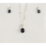 An 18ct white gold sapphire and diamond set pendant and ear-studs, the pendant with approx 0.