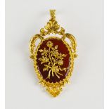 A 9ct gold, carnelian and diamond set brooch in the Rococo revival brooch / pendant,