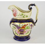 A large English porcelain jug, 19th century, with a scrolling handle and bellied body,