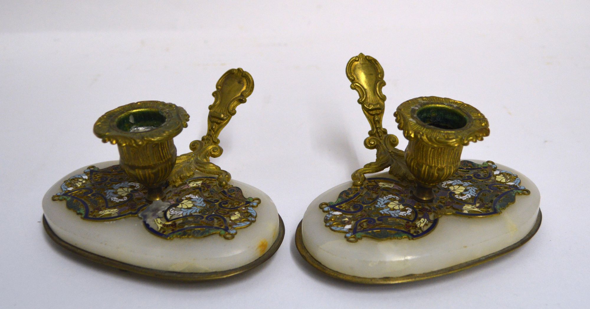 A pair of late 19th century French gilt brass chamber candlesticks,