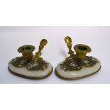 A pair of late 19th century French gilt brass chamber candlesticks,