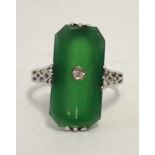 A white metal green chalcedony ring centred with a single diamond,