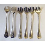 A set of twelve Continental white metal oyster forks, each terminal with cipher, approx 8.8oz.