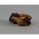 A Chinese jade model of a squatting beast, 19th/20th century, the stone of brown mottled type, 6cm