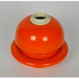 An unusual Italian circular domed pot and dished stand, 1960s/70s, glazed in orange, 17cm high there