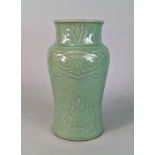 A Chinese celadon vase, 20th century, moulded with flower heads and stylised leaves, 31cm high