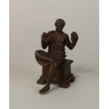 A bronze model of a seated Dionysus, 20th century in the Grand Tour style, holding a cup and bunch