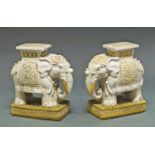 A pair of Chinese pottery garden seats, 20th century, modelled as elephants wearing rugs with Shou