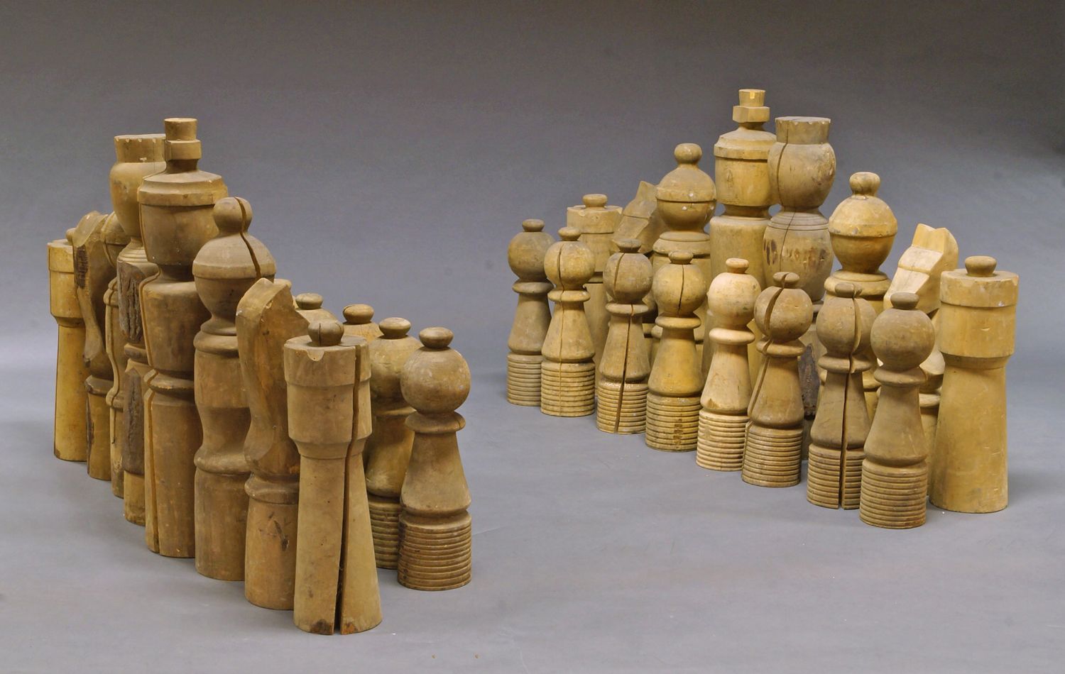 A large turned wood chess set, 20th century, the Kings 84cm high