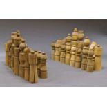 A large turned wood chess set, 20th century, the Kings 84cm high
