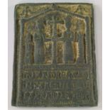 A bronze icon plaque, 20th century, moulded with figure flanking a cross, with cyrillic
