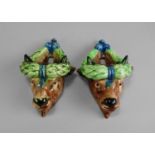 A pair of majolica wall pockets, 19th century in the form of bulls heads,