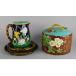 A George Jones majolica cheese dome, with looping handle, moulded with flowers and raspberries,