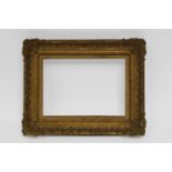 A Gilt Composition Louis XIII/XIV Transitional Style Frame, 20th century, with linen mounted slip,