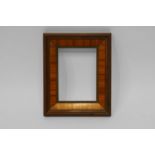 A French Rosewood Veneered Frame, 19th century, with rais-de-coeur sight, wedge frieze,