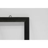 A Spanish Ebonised Bolection Frame, 17th century, plain sight, stepped cavetto, frieze,