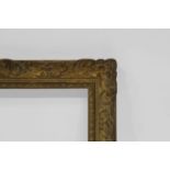 A Carved and Gilded Louis XIV Style Provincial Frame, early-mid 20th century, with dentil sight,