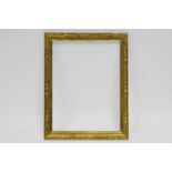 A Carved and Gilded Frame, 19th century, with wedge sight and leaf tied reeded cushioned frieze,