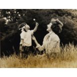 Bert Hardy, British 1913-1995- Mother and child with dandelion; gelatin silver print, with studio