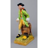 A Wedgwood model of Long John Silver, 20th century, modelled seated on a barrel,