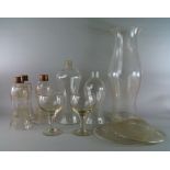 A pair of large drinking glasses, with faceted stems, on pad bases, 20cm high,