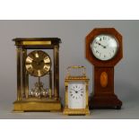 An Edwardian mahogany mantel clock, with octagonal topped case,