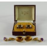 A pair of 9ct gold, sapphire and ruby set cufflinks, in the form of a gate, approx 7.