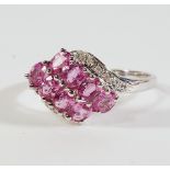 A 9ct white gold, pink sapphire and diamond set dress ring,