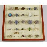 A collection of twenty-five silver and gem set dress rings, to include rutilated quartz, tanzanite,