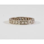 A diamond set full eternity ring, set in unmarked white metal, approx size O, approx 4g.