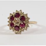 An 18ct gold, diamond and ruby cluster ring, the central diamond approx 0.25ct, approx size N.