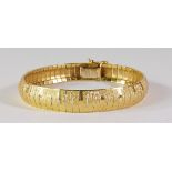 An 18ct gold bracelet, with textured and polished surface, approx 19cm long, approx 21g.