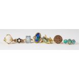 A collection of seven dress rings, to include and 18ct gold, three stone opal doublet ring,