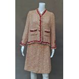 Chanel couture 60190P81: a cream and cerise wool boucle two piece skirt and jacket suit,