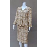 Chanel Boutique: a wool boucle skirt and jacket suit, in taupe, natural and duck-egg blue,