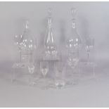 A large suite of Orrefors drinking glasses and decanters, to comprise eleven wine glasses 21cm high,